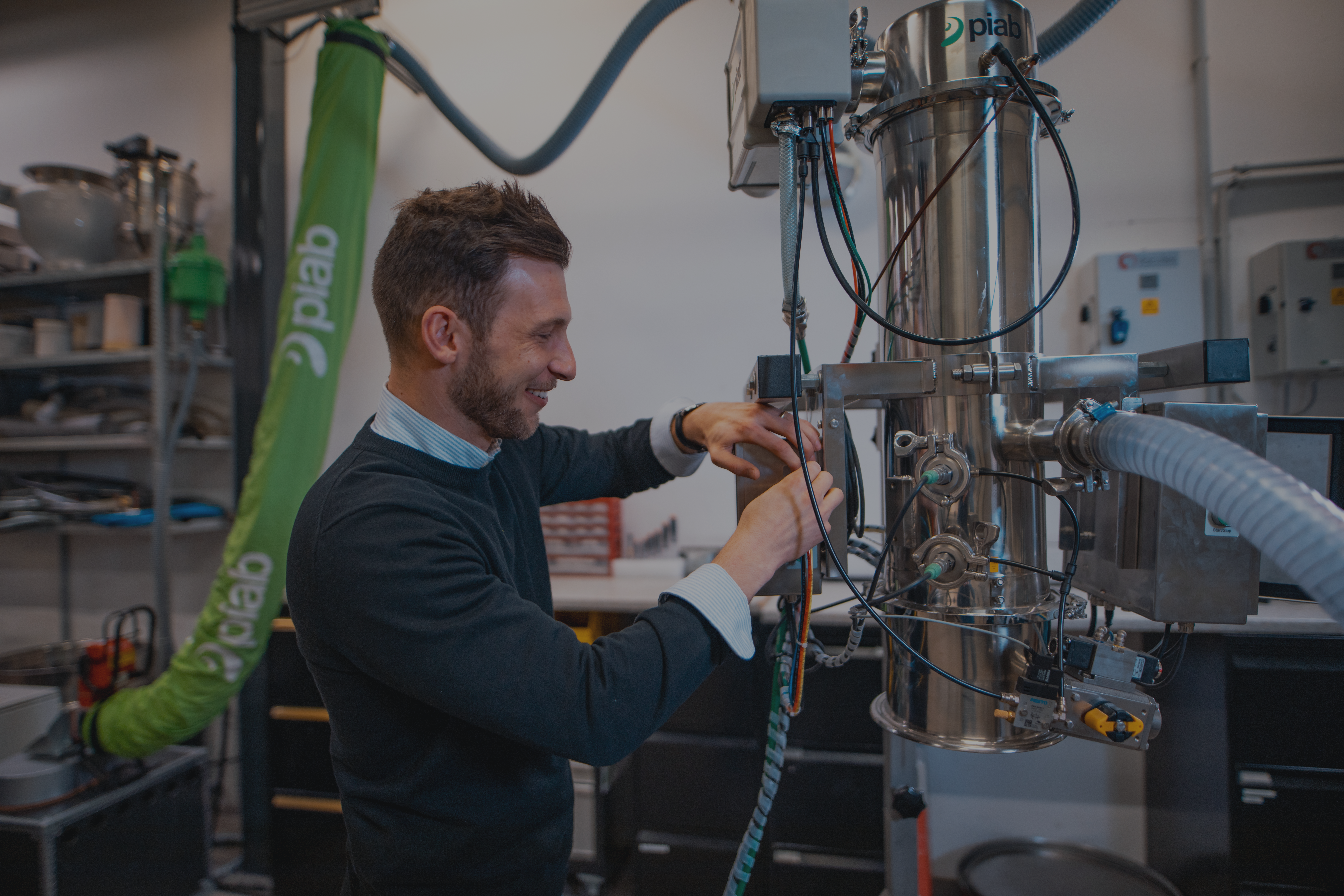 Maintenance manager adjusting a Piab vacuum conveyor